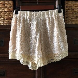 MOTEL Lola milky sequence\cream with lace detail party short in size XS